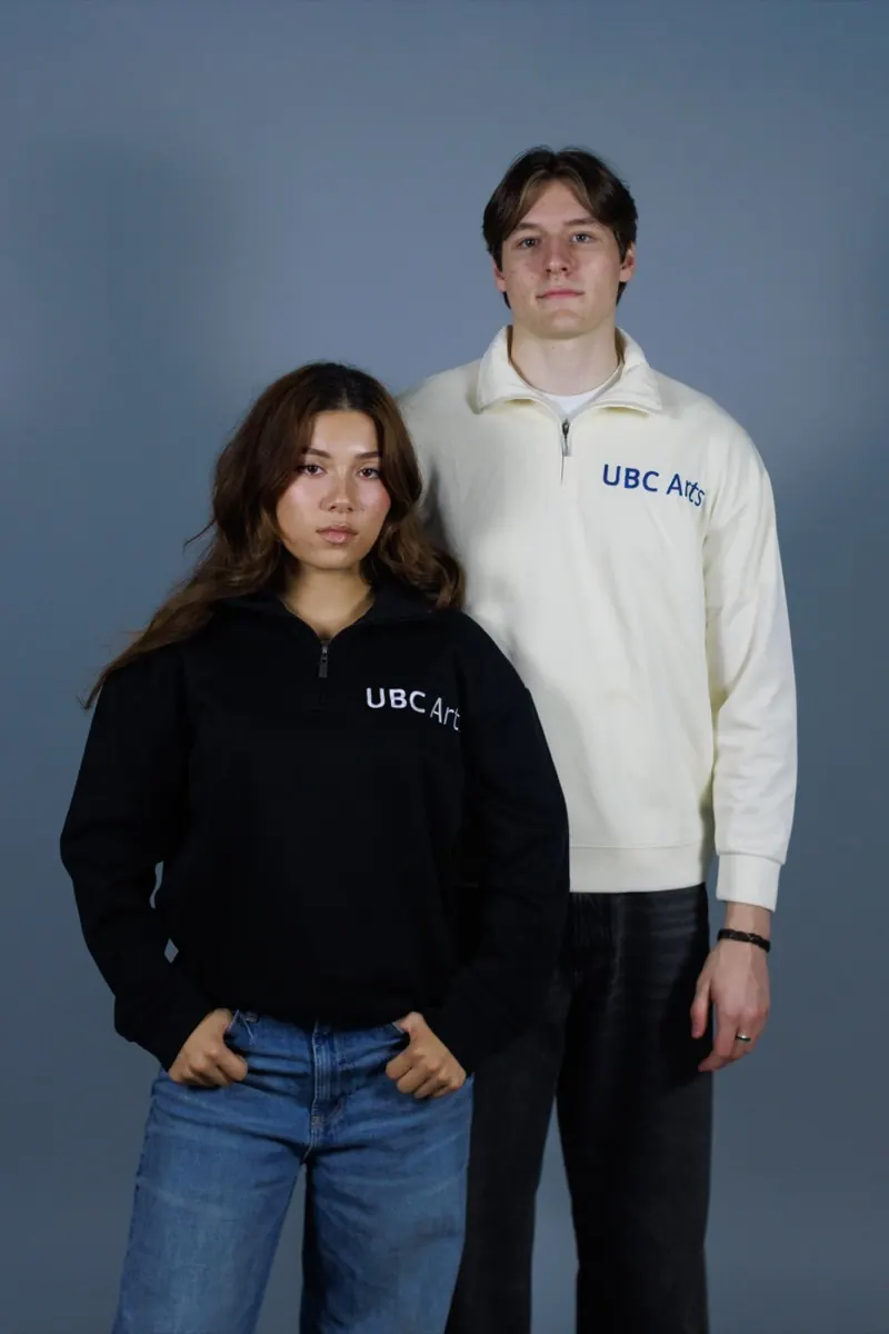 Black and cream quarter-zips with 'UBC Arts' on the chest