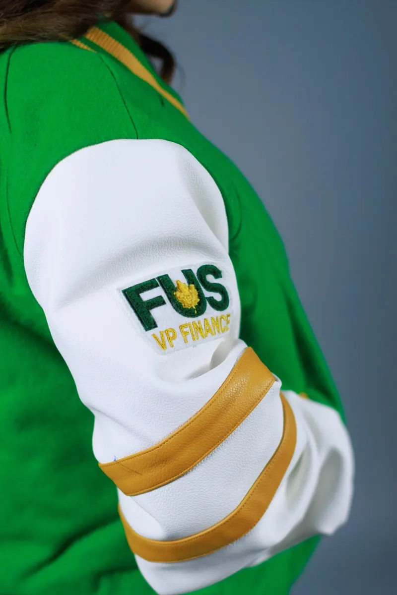 Close-up of an embroidered patch on a varsity jacket sleeve